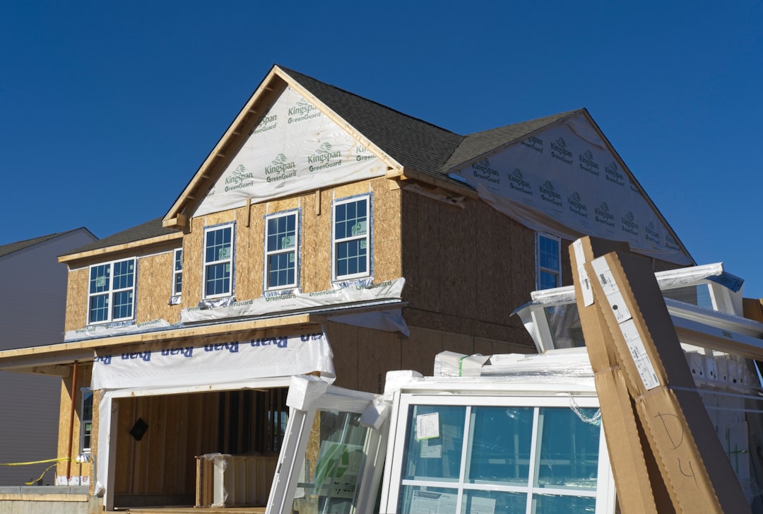 Framing contractor crew working on an unfinished building frame in New Jersey