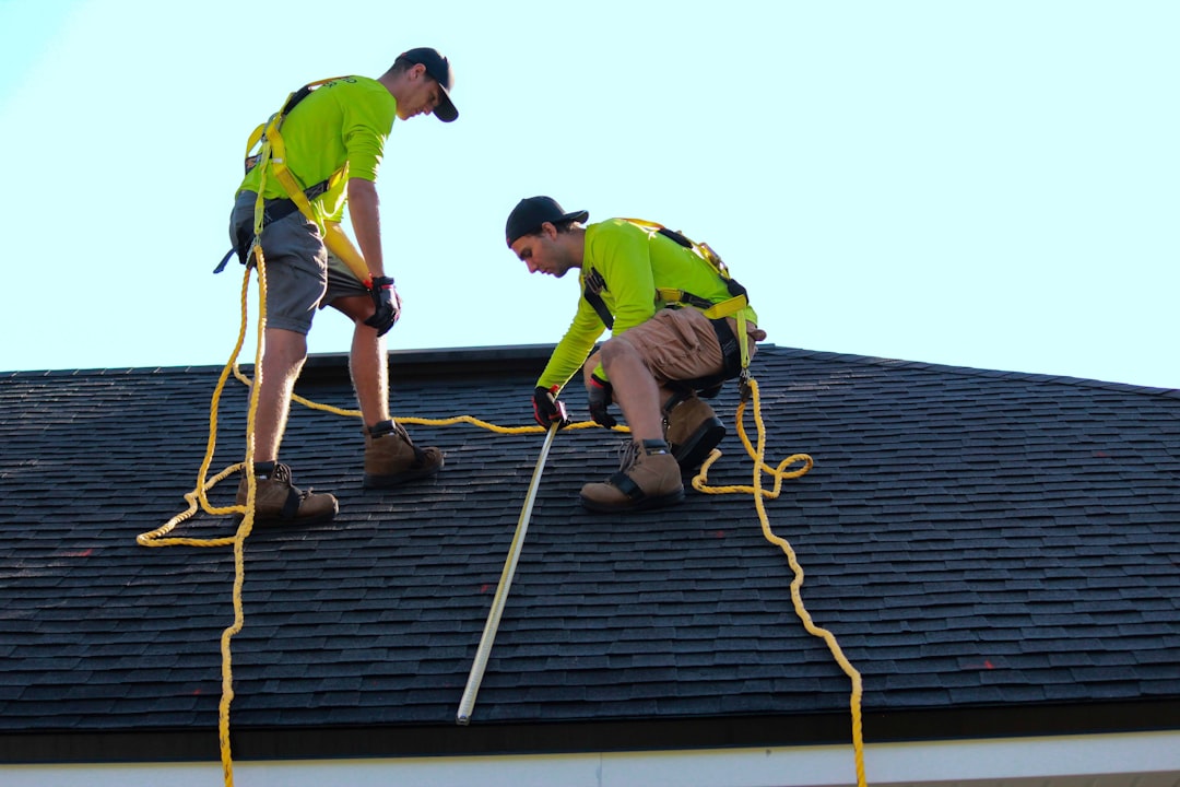 Roofing contractor working at height on a Connecticut job site near an OSHA fall protection citation area