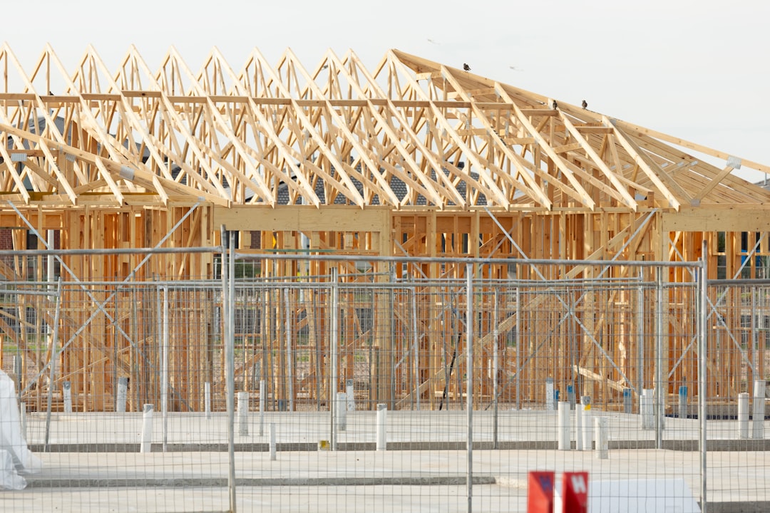 Framing contractor using a ladder on a construction site in Louisiana, related to an OSHA ladder violation citation