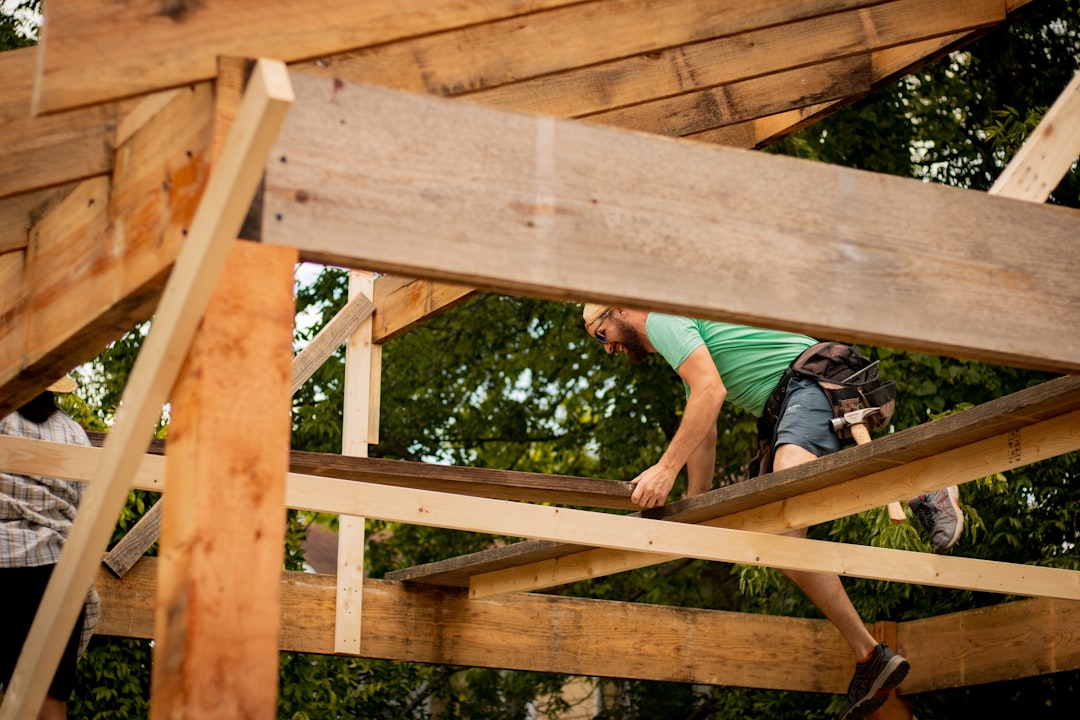 Framing contractor working at height on a Georgia residential job site without fall protection, illustrating OSHA 1926.501 violations