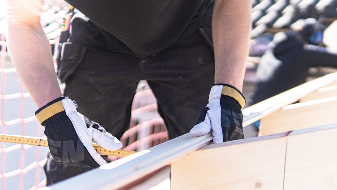 Framing contractor working at height on a North Carolina residential construction site without fall protection