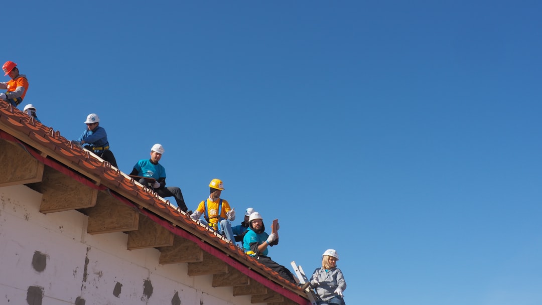 Stucco and specialty trade contractor working on scaffolding at a South Carolina job site
