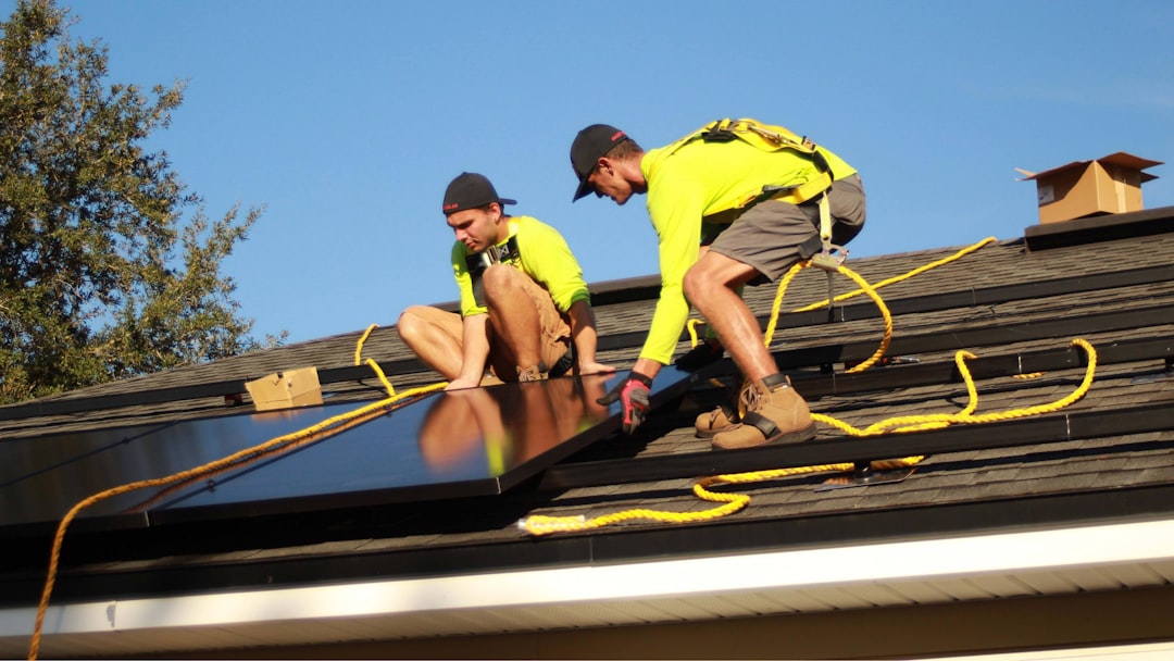 Construction worker on a residential remodeling roof in Rhode Island without visible fall protection equipment