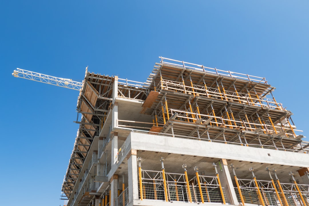Roofing contractor working at height on a Missouri jobsite without fall protection equipment