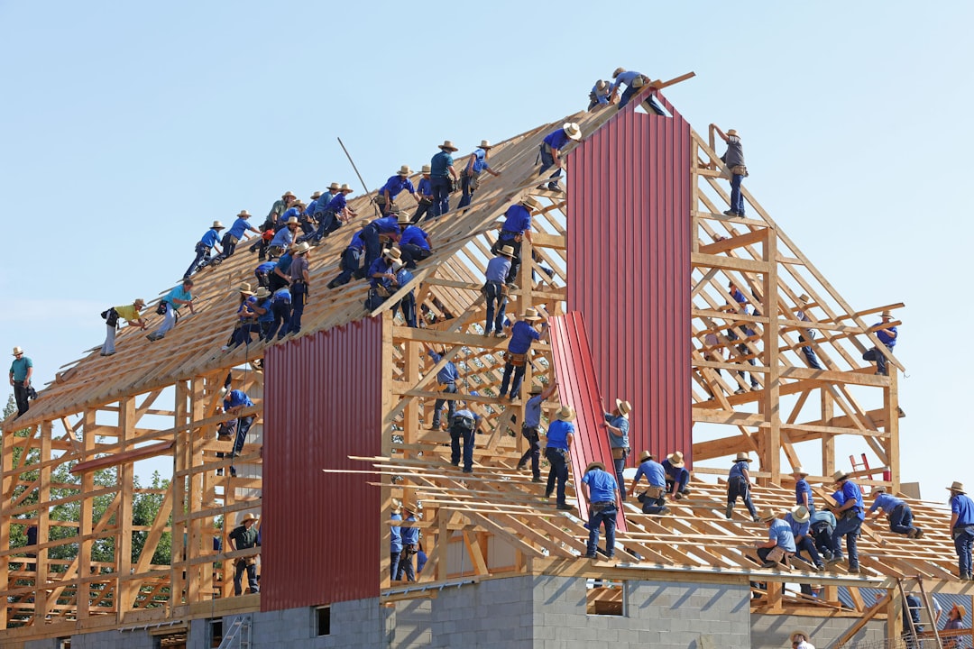 Roofing contractor working at height without fall protection on a Utah residential jobsite