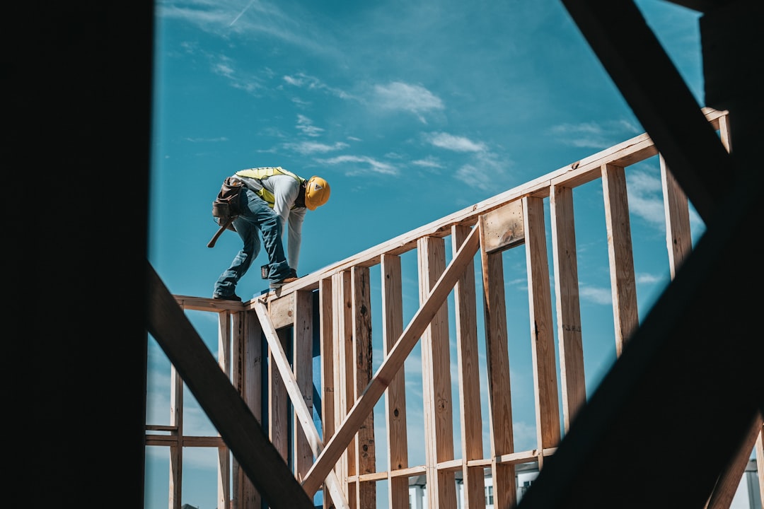Roofing worker on an Anchorage, Alaska construction site without visible fall protection equipment