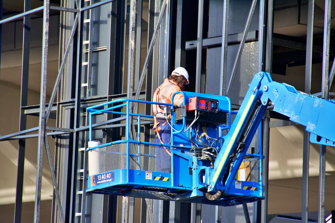 Roofing contractor working at height on a job site in Ohio without fall protection equipment