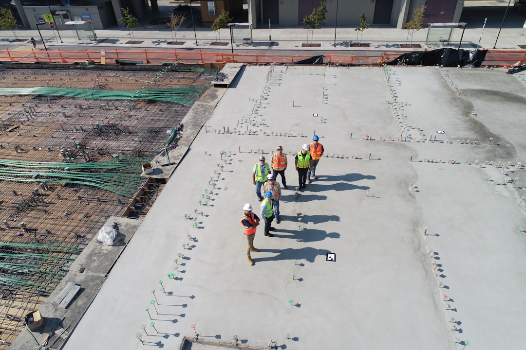 Roofing and specialty trade contractor working at height on a Nevada construction site without proper fall protection