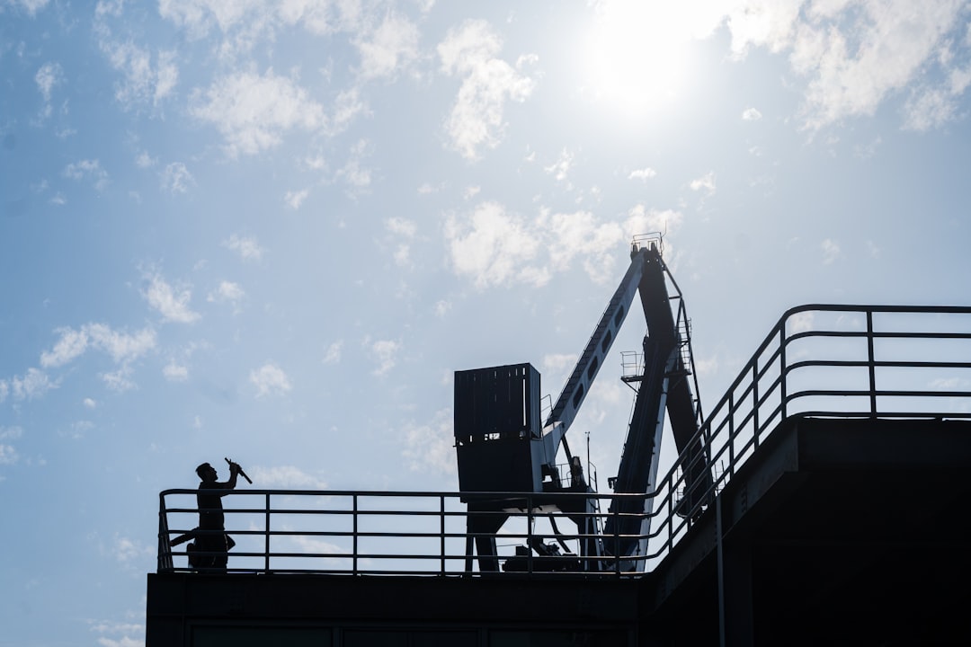 Roofing contractor working at height without fall protection on an Indiana job site, illustrating an OSHA 1926.501 violation