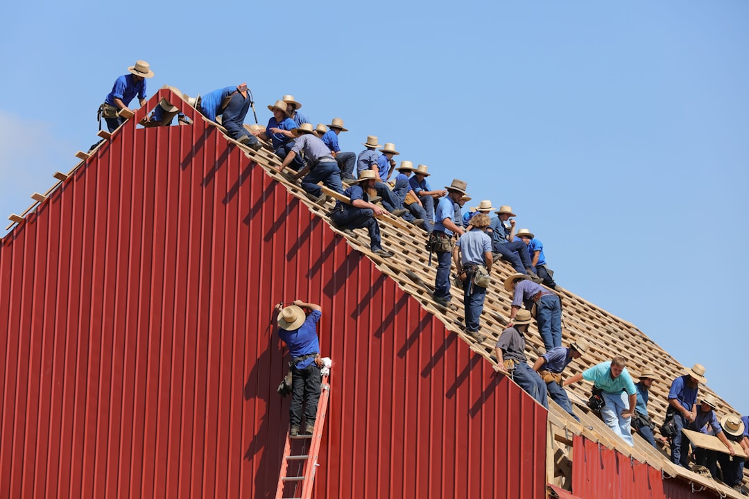 Roofing contractor working at height on a Tennessee construction site without visible fall protection