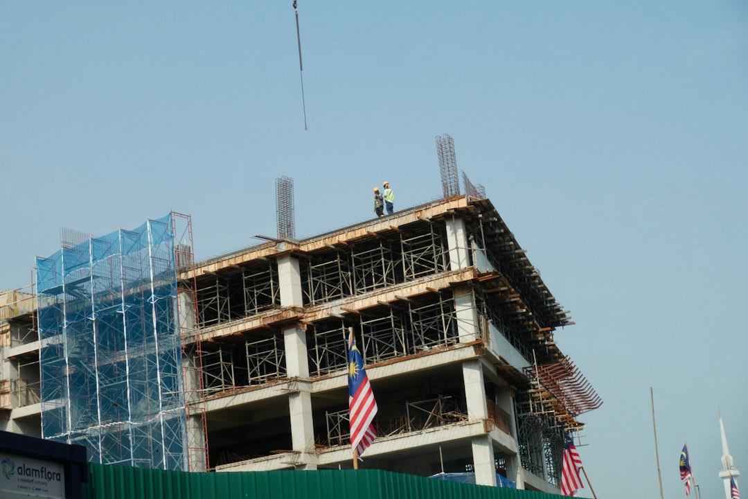 Framing contractor crew working at height without fall protection on a Georgia residential job site