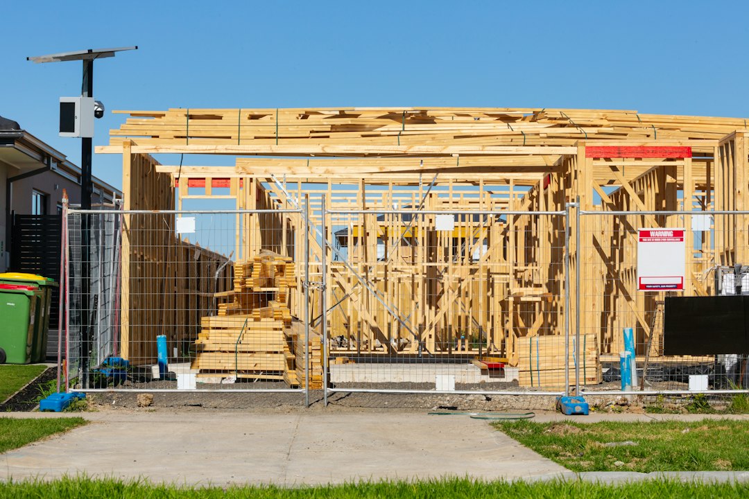 Framing contractor working at height on a South Carolina construction site without visible fall protection