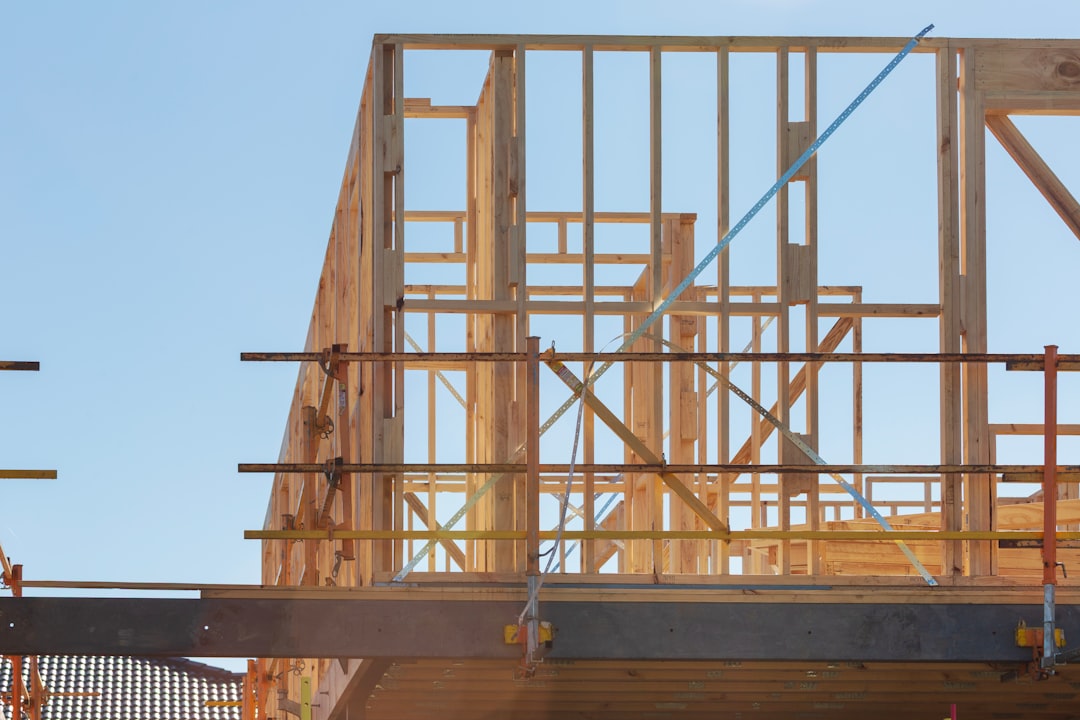 Framing contractor working at height on a Texas construction site without fall protection
