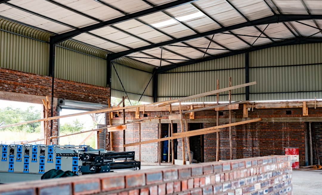 Roofing contractor working near an unprotected roof edge in Arizona, the kind of fall hazard cited under OSHA 1926.501