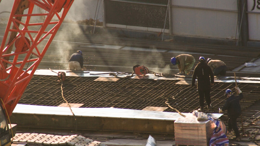 Scaffolding erected on a construction site in New York with workers accessing an upper platform