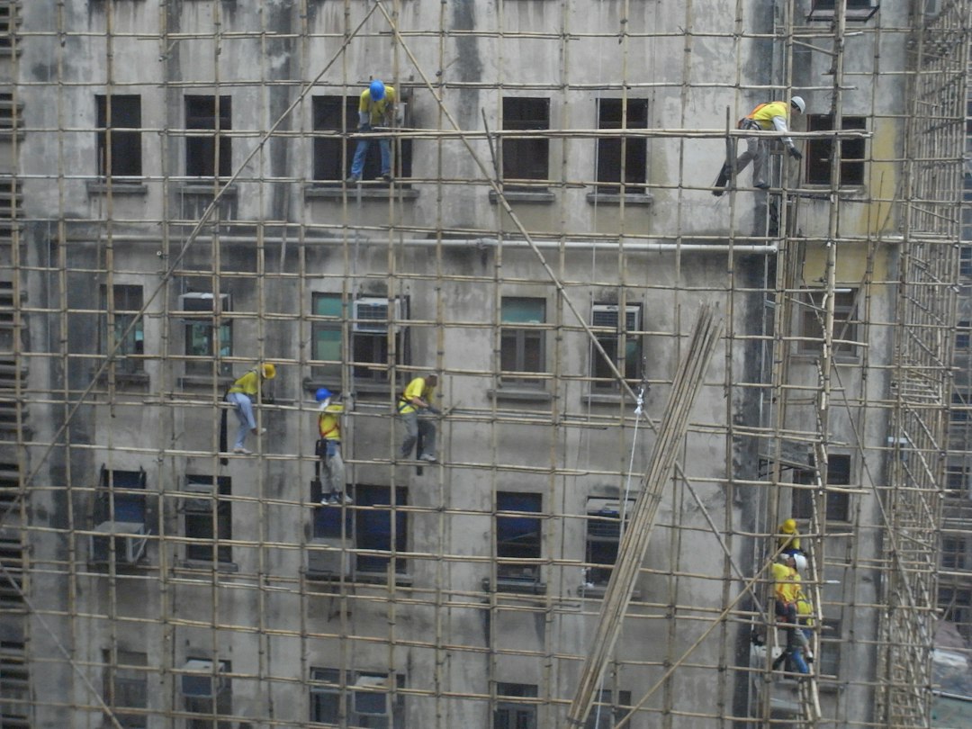 Siding contractor crew working on scaffolding at a construction site in South Dakota