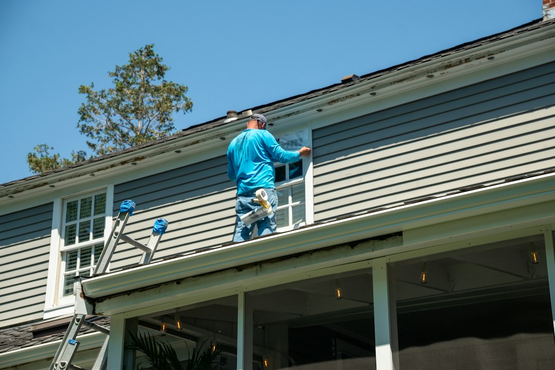 Construction worker on an extension ladder at a Nevada jobsite during an OSHA ladder safety inspection